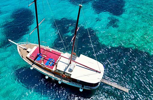 The deck of Galatea boat with sunbeds